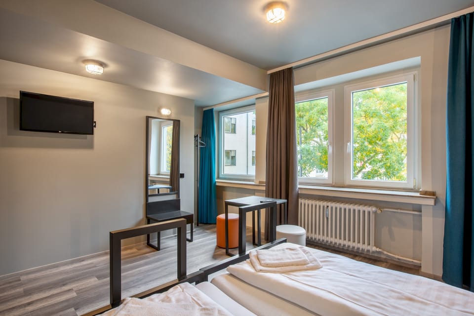 Twin Room | Desk, blackout drapes, iron/ironing board, free WiFi