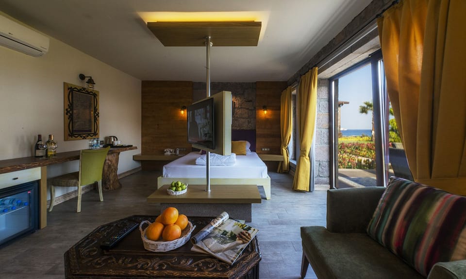 Family Room, Balcony, Sea View | Minibar, in-room safe, desk, soundproofing