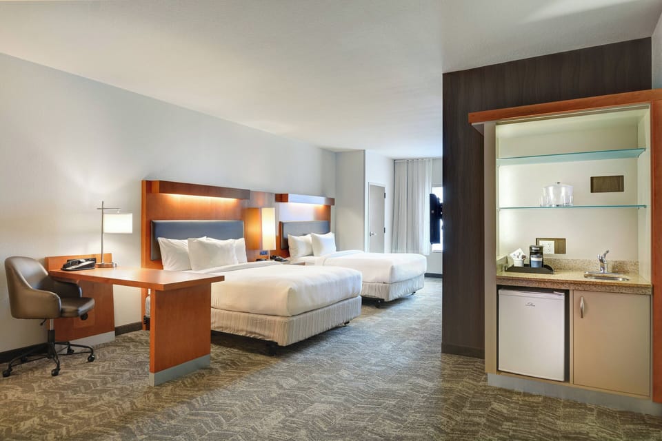 Down comforters, pillowtop beds, in-room safe, desk