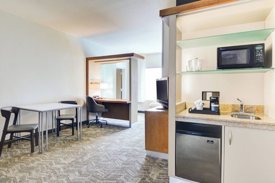 Down comforters, pillowtop beds, in-room safe, desk