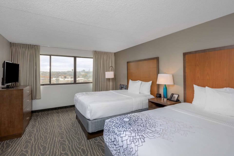 Deluxe Suite, 2 Queen Beds, Non Smoking, City View | Desk, blackout drapes, iron/ironing board, free cribs/infant beds