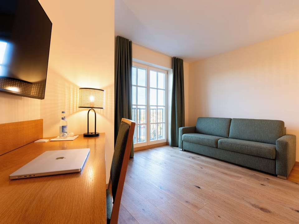 Family Double Room, 1 King Bed with Sofa bed, Pets Not Allowed | Living area | 50-inch Smart TV with satellite channels