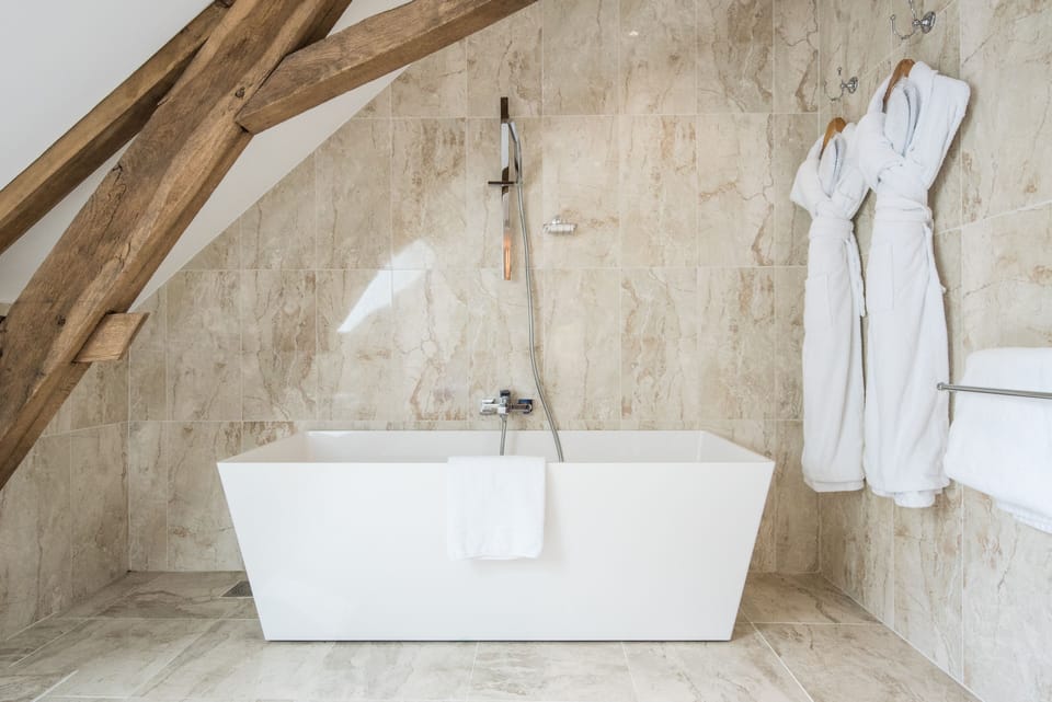 Separate tub and shower, free toiletries, hair dryer, slippers