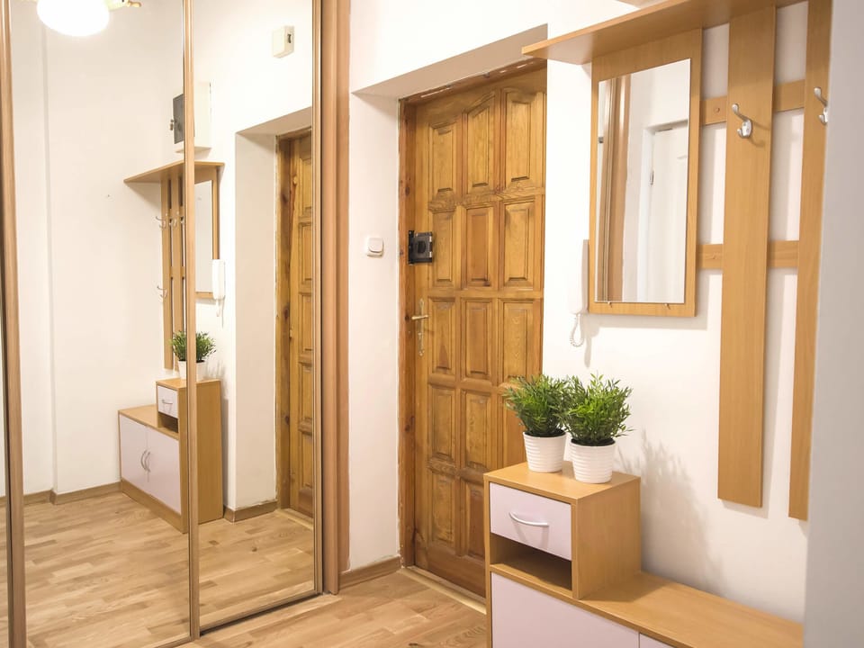 Apartment (VacationClub - Willa Carmen Apartment) | Living area | Flat-screen TV
