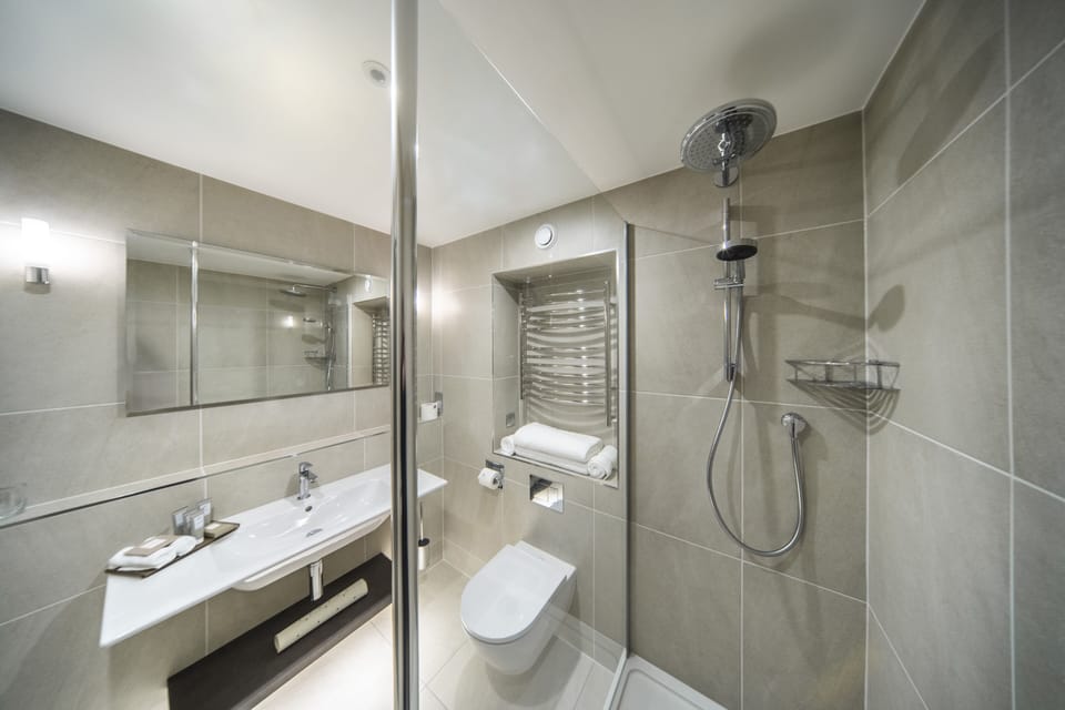 Designer toiletries, hair dryer, bathrobes, slippers