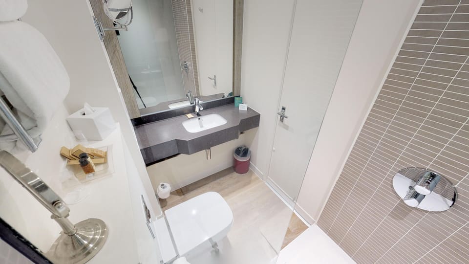 Bathtub, hair dryer, towels