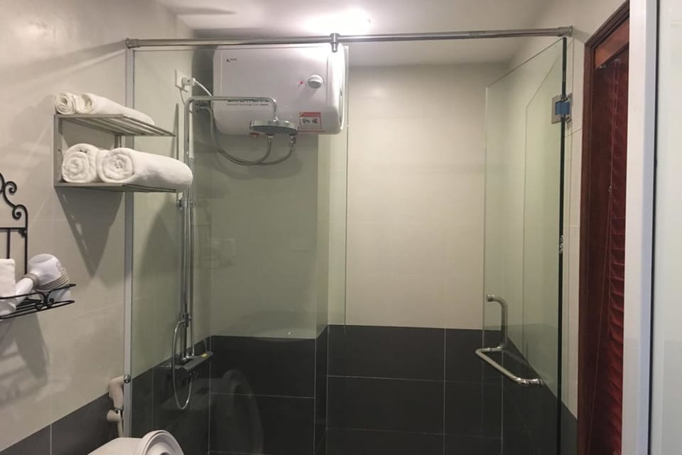 Shower, free toiletries, hair dryer, slippers