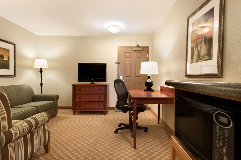 Desk, laptop workspace, blackout drapes, iron/ironing board