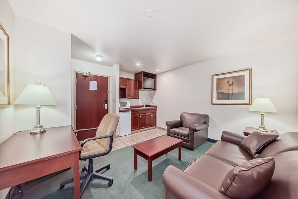 Suite, 1 Queen Bed with Sofa bed | Living area | 42-inch flat-screen TV with cable channels, TV, fireplace