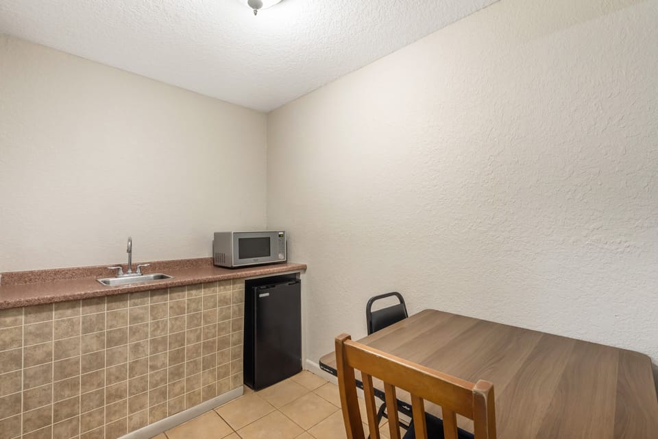 Suite, 1 King Bed, Smoking, Jetted Tub | Desk, laptop workspace, blackout drapes, free cribs/infant beds