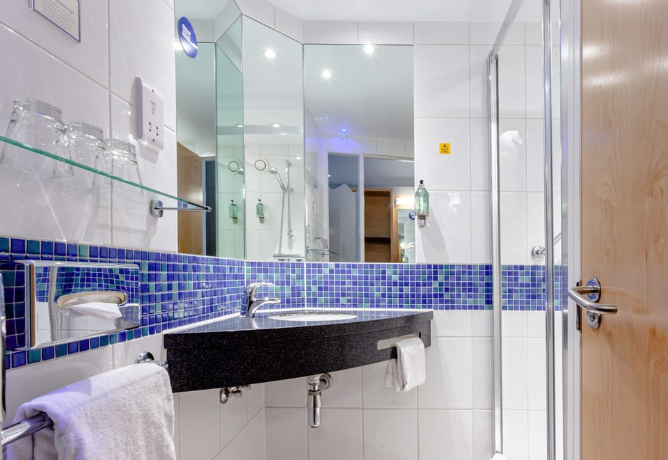 Shower, eco-friendly toiletries, hair dryer, towels