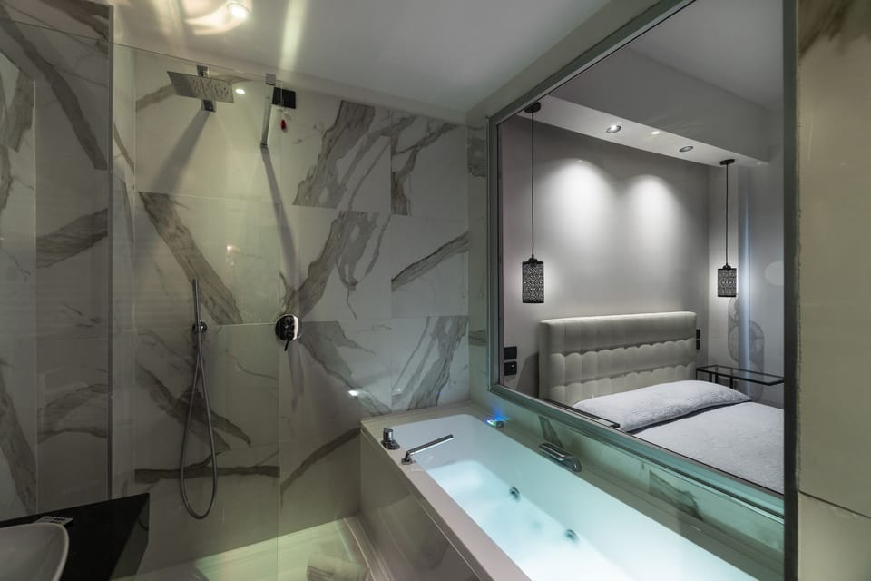 Luxury Suite, 1 King Bed, Private Bathroom, City View | Bathroom | Combined shower/tub, rainfall showerhead, free toiletries, hair dryer