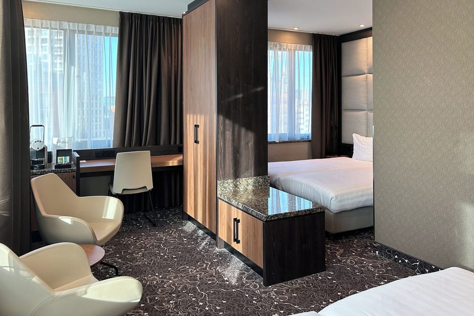 Quadruple Room | Living area | Flat-screen TV