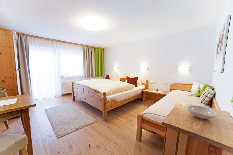 Family Room, Balcony (3 people) | Premium bedding, down comforters, individually decorated, desk