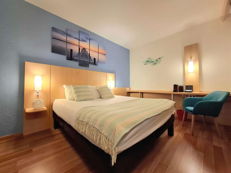 Premium bedding, desk, laptop workspace, blackout drapes