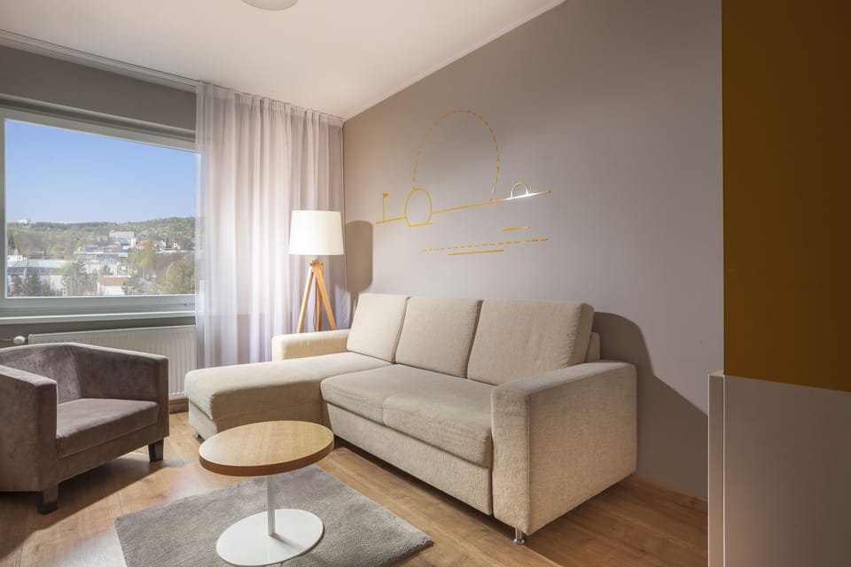 Superior Suite | Living area | 43-inch Smart TV with cable channels