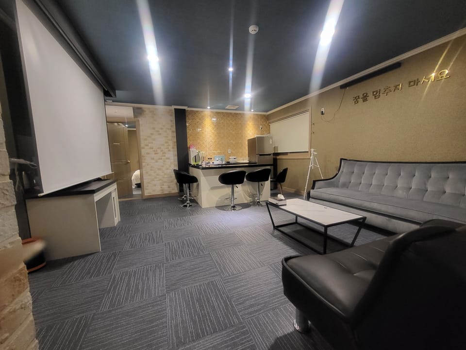 Suite Room (Include Caravan, BBQ available, Free Netflix, Styler, Air purifier, Cooking) | Living area | 51-inch flat-screen TV with cable channels, TV, Netflix