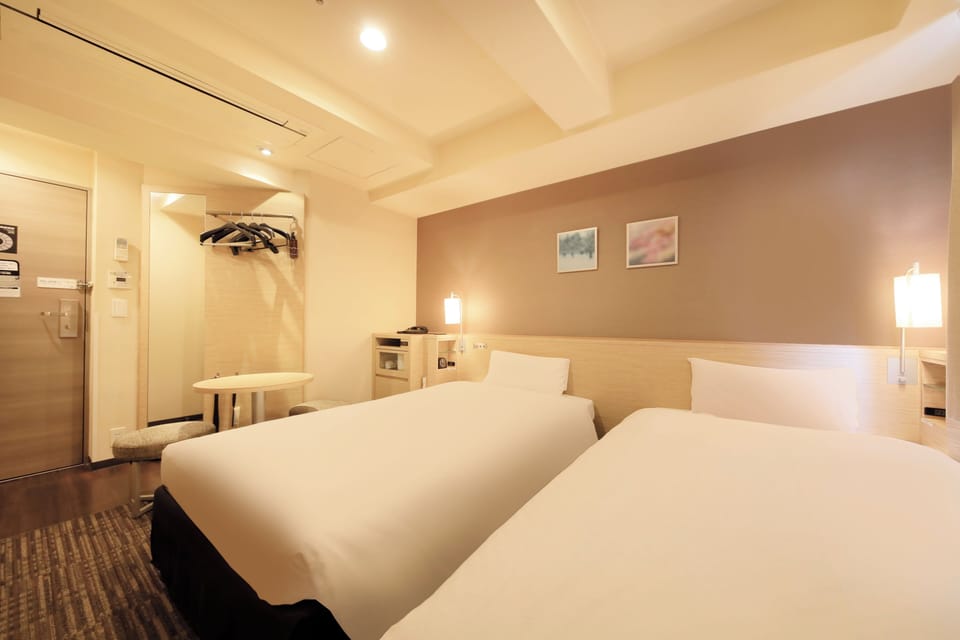 Twin Room, Non Smoking | Down comforters, free WiFi, bed sheets