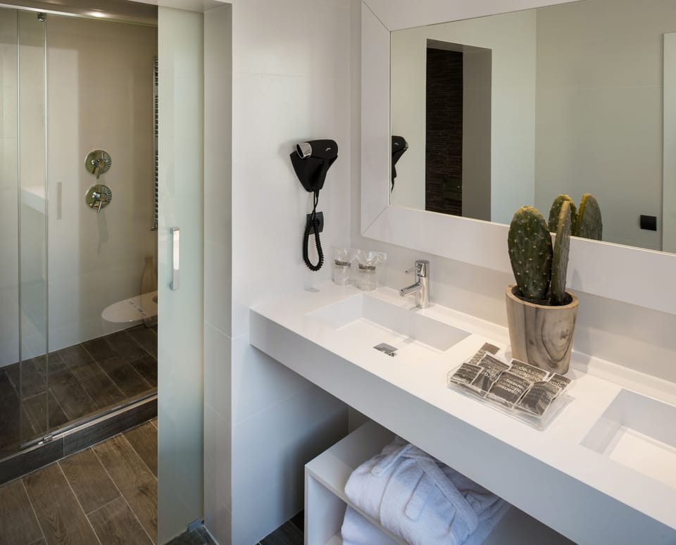 Bathtub, eco-friendly toiletries, hair dryer, towels
