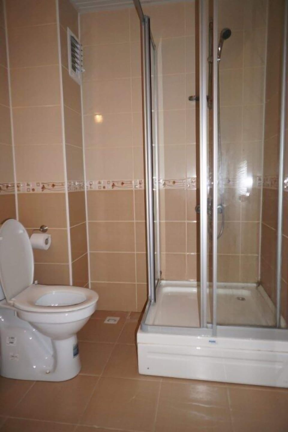 Shower, hair dryer, slippers, towels