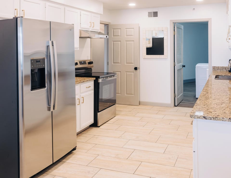 Suite, 1 King Bed, Balcony (Legendary) | Private kitchen | Coffee/tea maker