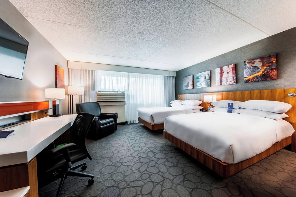 Room, 2 Double Beds | In-room safe, desk, laptop workspace, blackout drapes