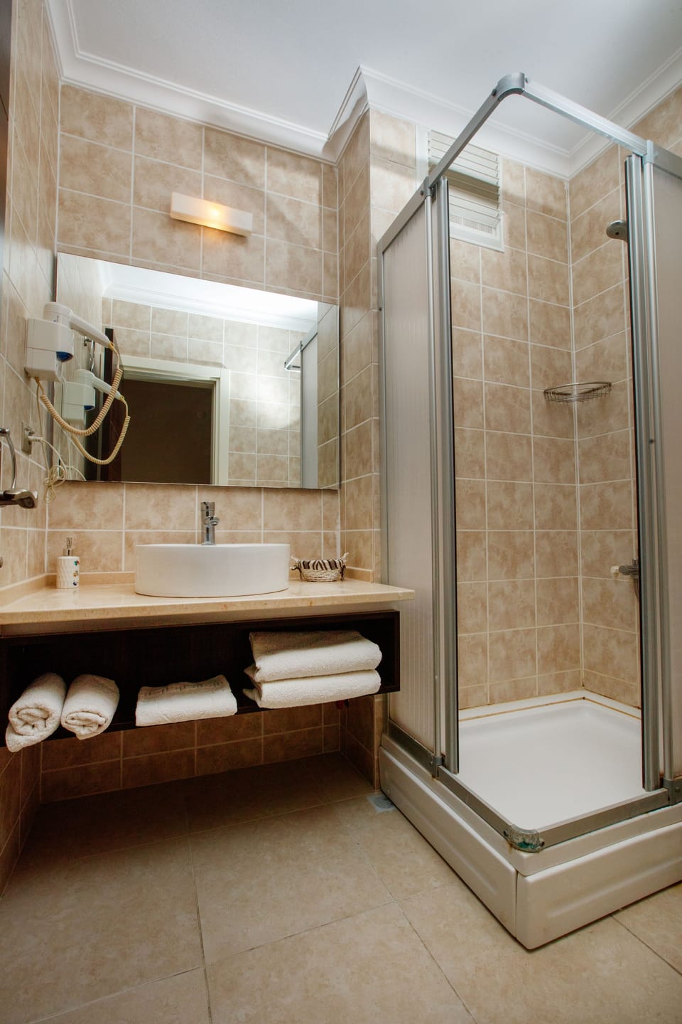 Shower, free toiletries, hair dryer, slippers
