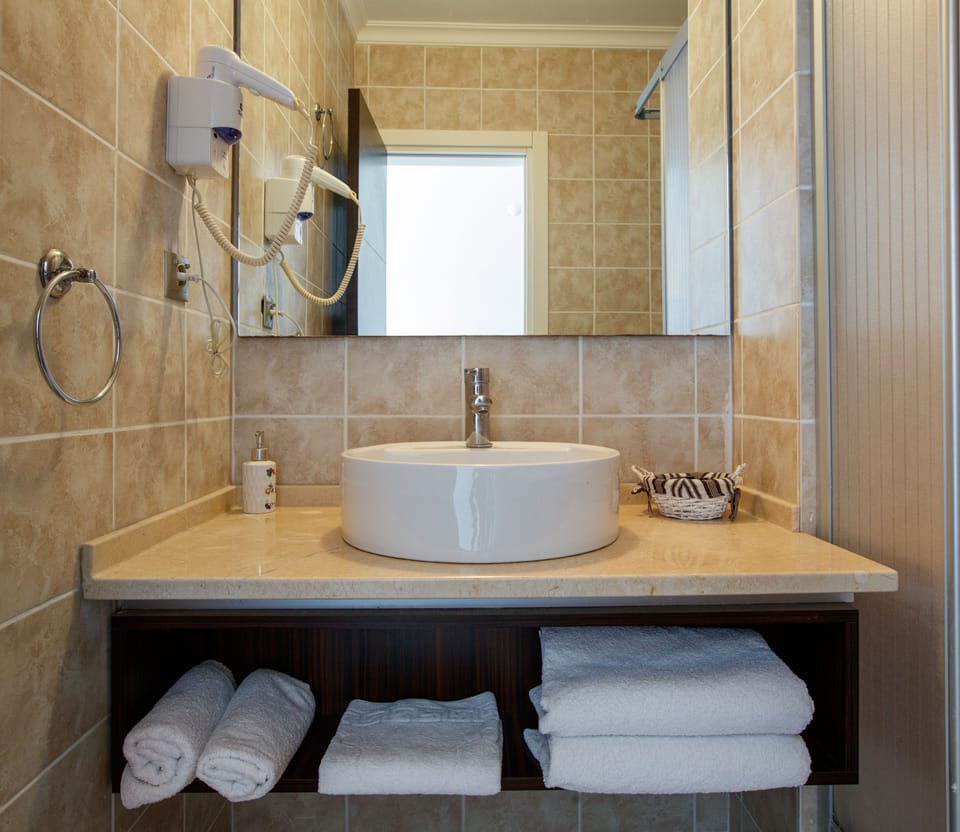 Shower, free toiletries, hair dryer, slippers