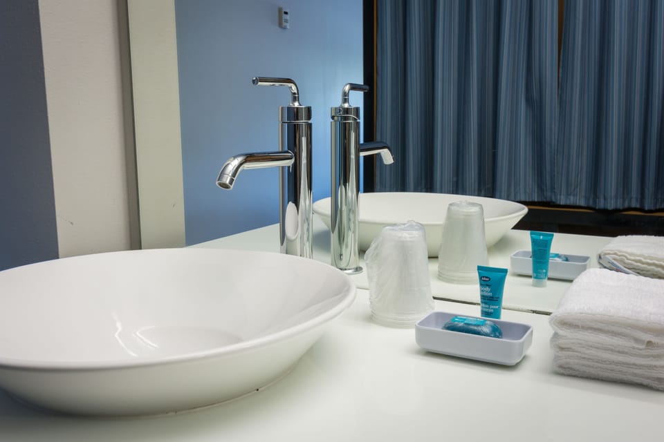Rainfall showerhead, designer toiletries, hair dryer, towels