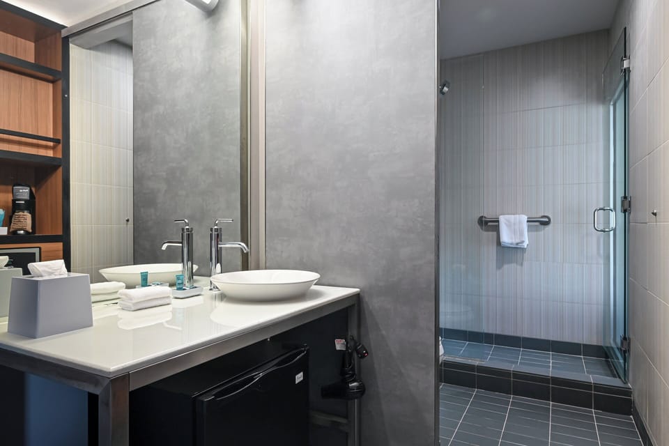 Rainfall showerhead, designer toiletries, hair dryer, towels