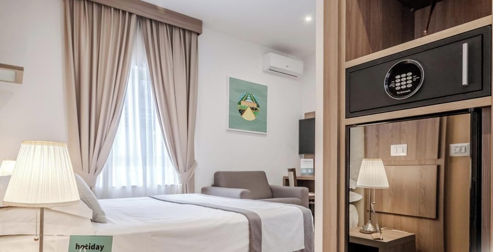 Triple Room | Minibar, in-room safe, desk, soundproofing