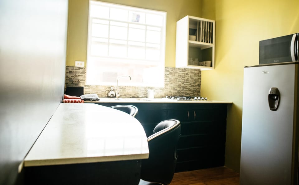 Romantic Suite, 1 Queen Bed, Patio, Partial Lake View | Private kitchen | Full-size fridge, microwave, stovetop, electric kettle