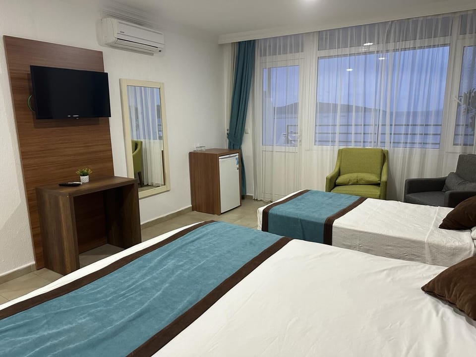 Luxury Triple Room, Sea View | Premium bedding, desk, laptop workspace, soundproofing