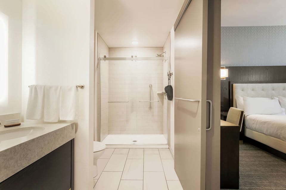 Suite, 1 King Bed, Corner | In-room safe, blackout drapes, iron/ironing board, cribs/infant beds