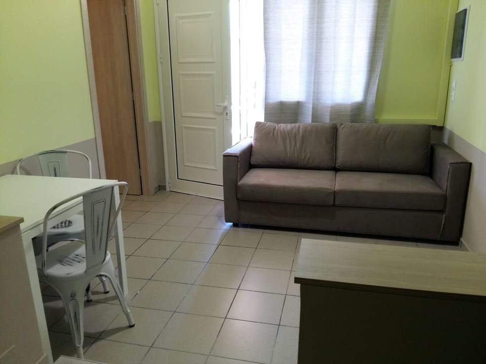 Deluxe Studio | Living area | Flat-screen TV
