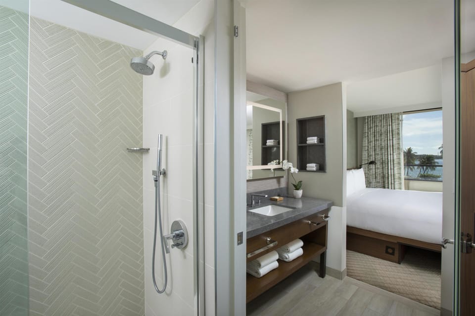 Room, 1 King Bed with Sofa bed, Ocean View, Corner | Bathroom | Hair dryer, bathrobes, slippers, towels