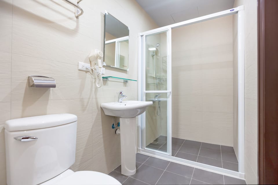 Economy Twin Room, No Windows | Bathroom | Shower, hydromassage showerhead, bathrobes, slippers