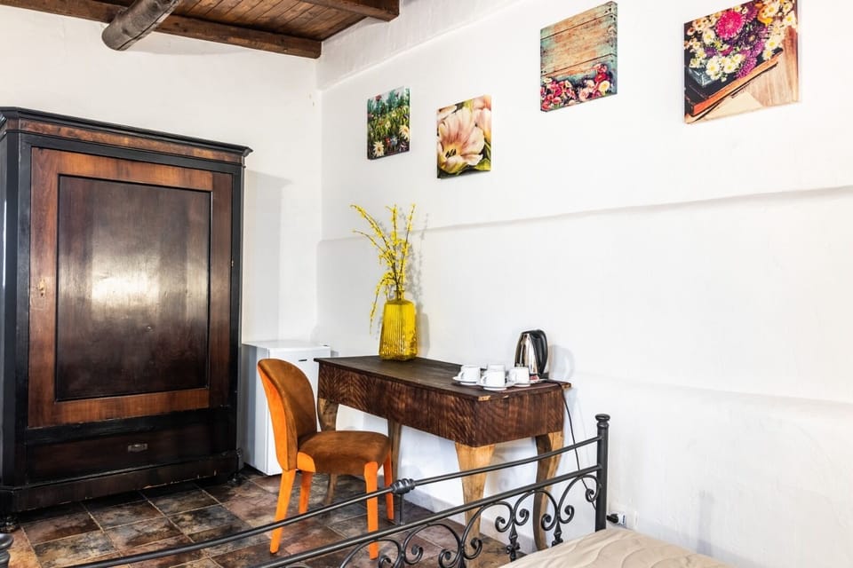 Quadruple Room | Minibar, in-room safe, individually decorated, individually furnished