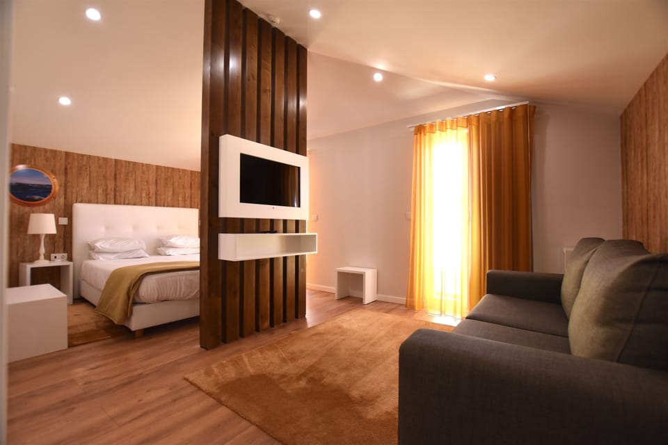 Junior Suite, Balcony | Living area | Flat-screen TV