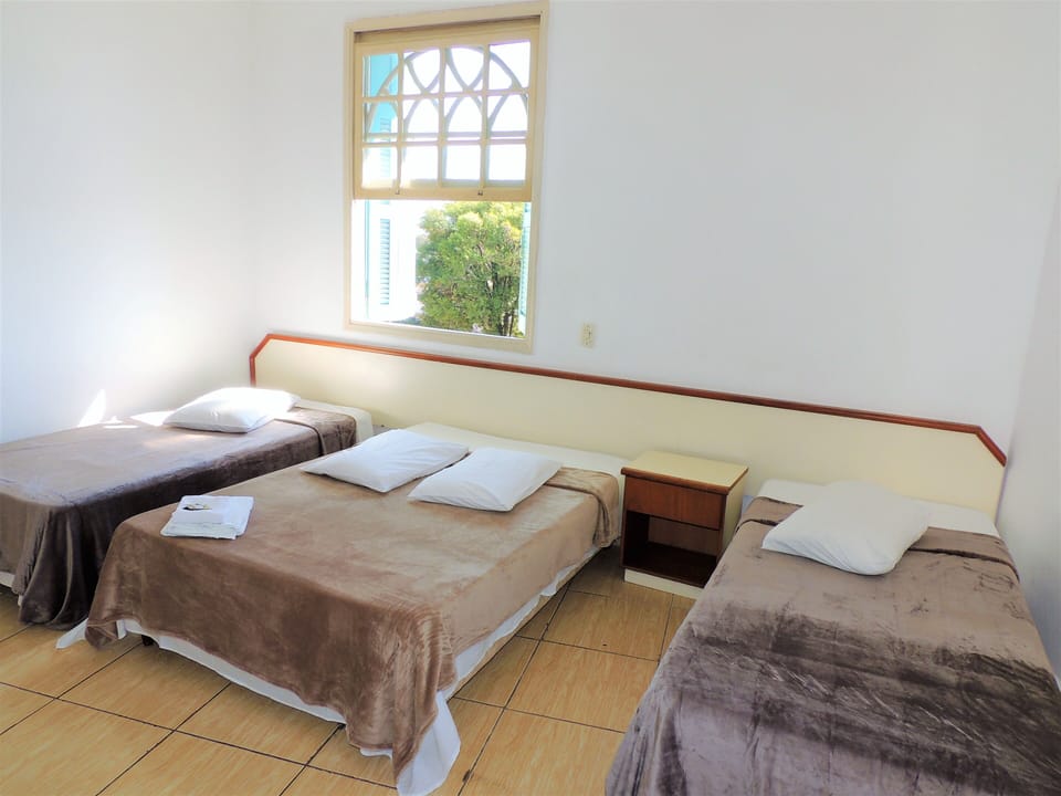 Family Quadruple Room | Minibar, desk, free WiFi, bed sheets