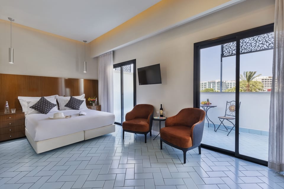 Junior Suite, Balcony | Minibar, in-room safe, soundproofing, iron/ironing board
