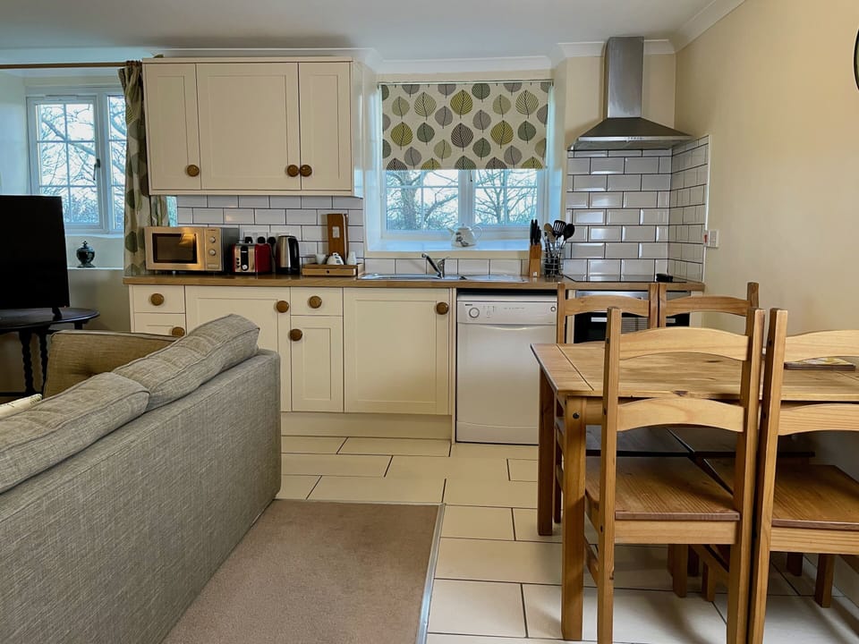 Family Cottage, Ensuite (Pendragon CottageHengroen) | Private kitchen | Highchair