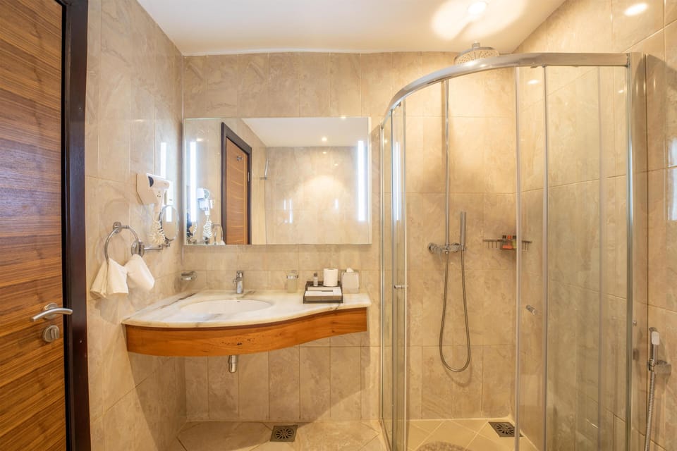 Eco-friendly toiletries, hair dryer, bathrobes, slippers