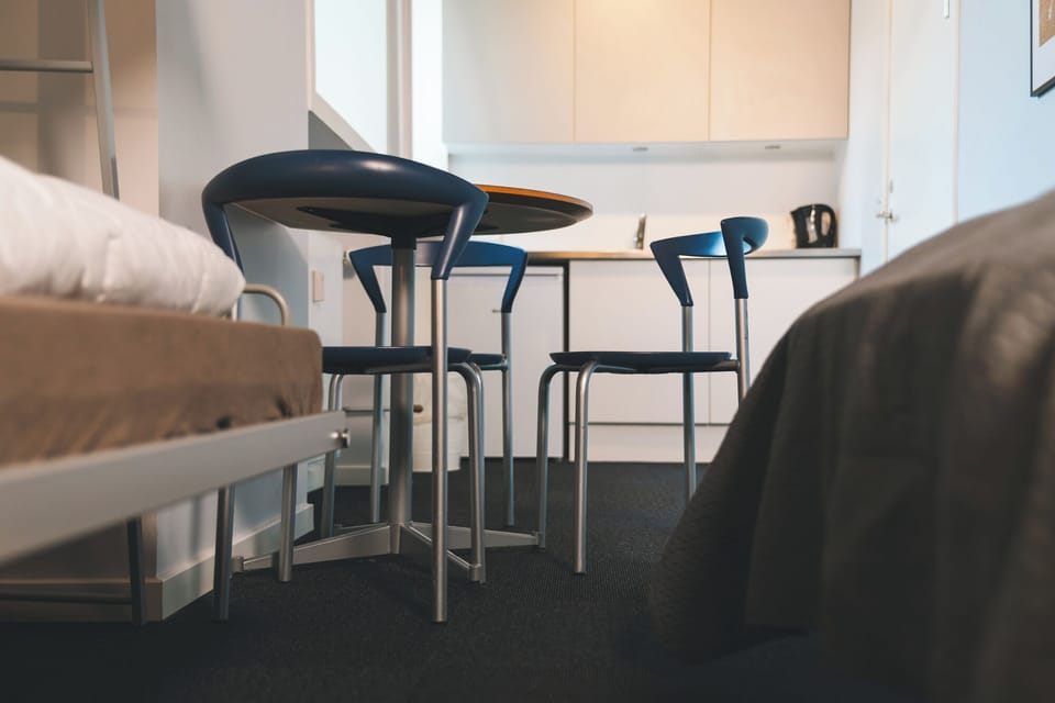 Private 8 bedded room with private bathroom and kitchenette | Living area | Books