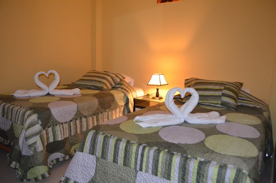 Twin Room, Shared Bathroom | Down comforters, in-room safe, desk, laptop workspace