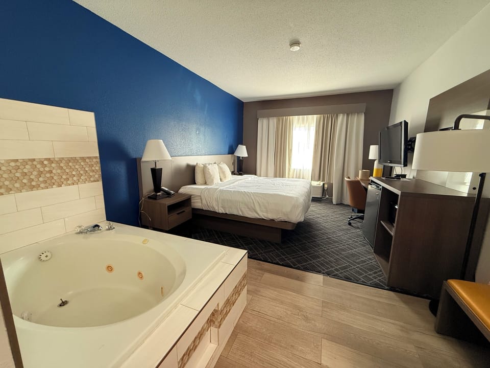 Room, 1 King Bed, Non Smoking (In-Room Whirlpool) | Desk, iron/ironing board, free WiFi, bed sheets