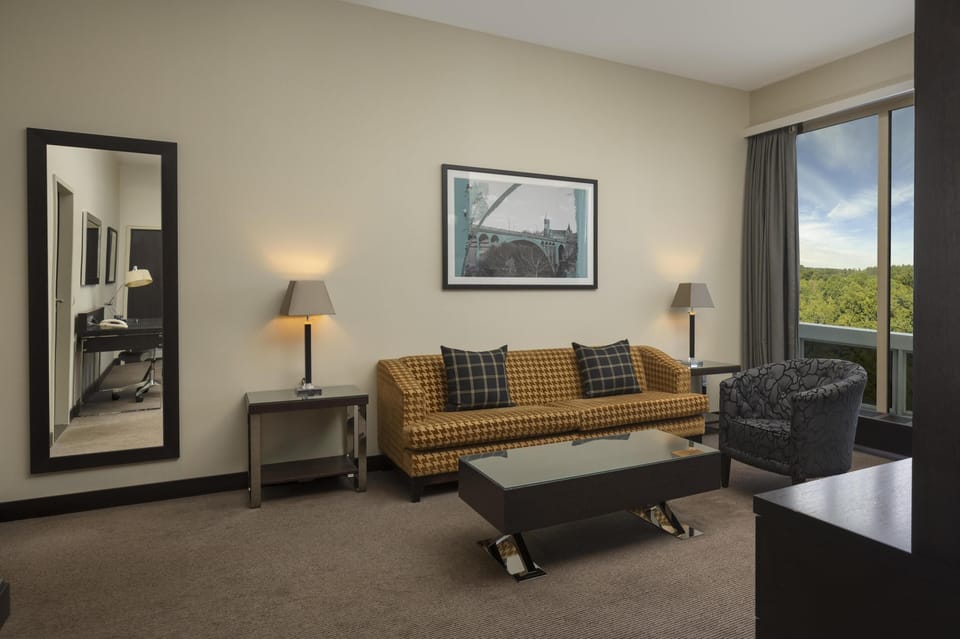 Deluxe Suite | Living area | 37-inch LED TV with cable channels, TV, MP3 dock