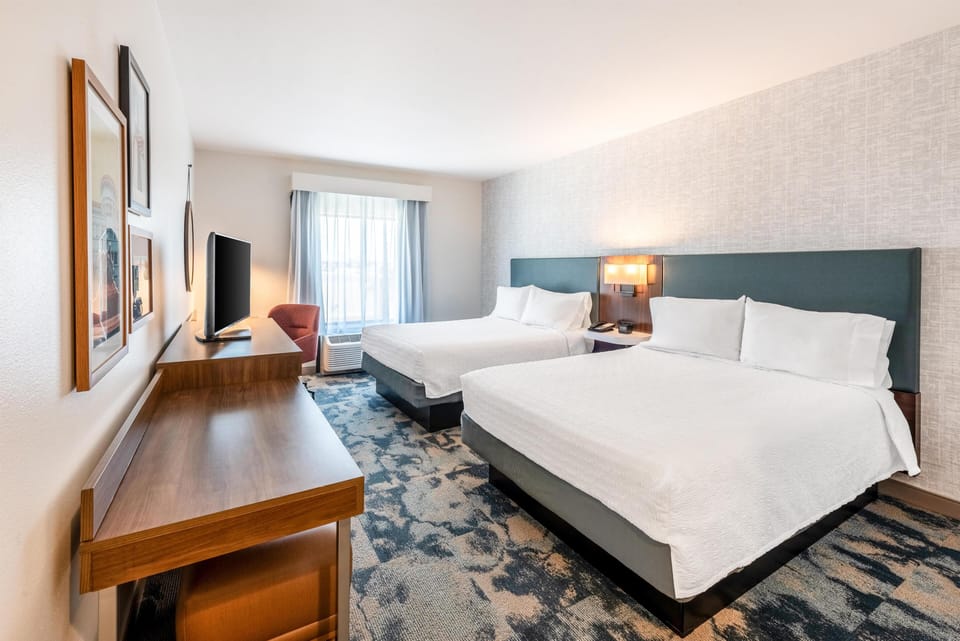 Premium bedding, desk, laptop workspace, free WiFi
