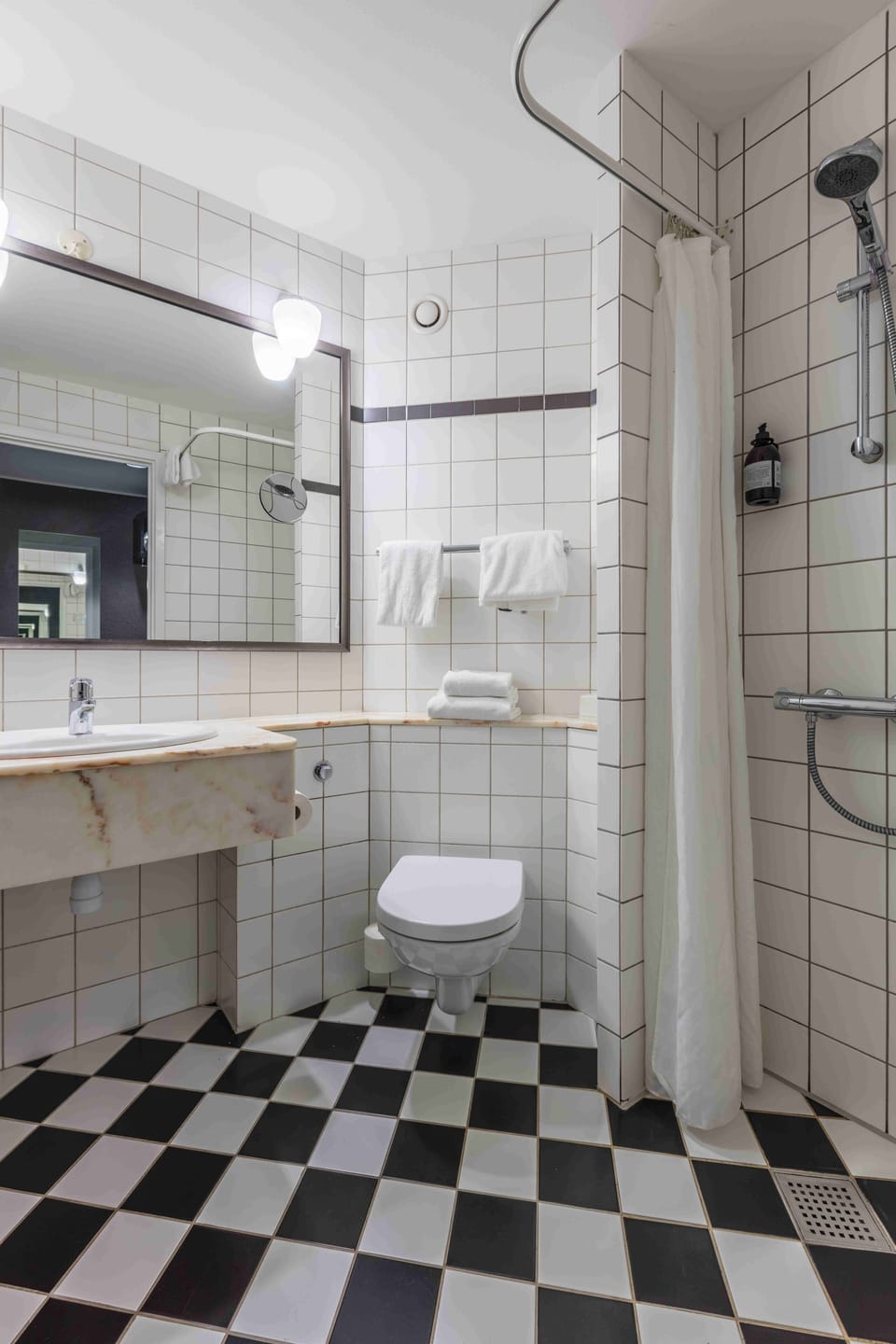 Shower, eco-friendly toiletries, hair dryer, towels