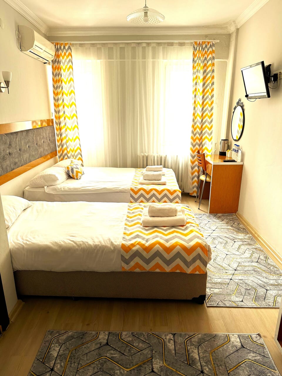 Standard Triple Room, Balcony | Minibar, in-room safe, desk, iron/ironing board